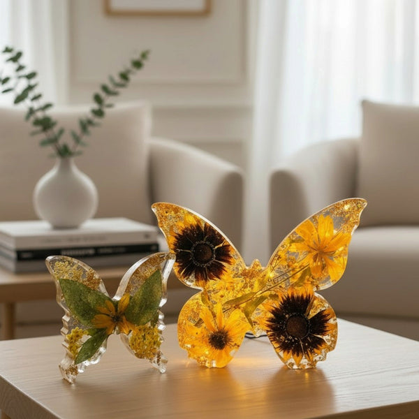 Light up resin butterfly decor set of two clear amber butterflies with embedded yellow flowers, green leaves and gold flecks