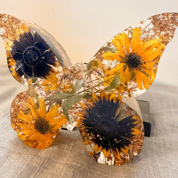 Light up resin butterfly decor set with two clear resin butterflies, orange sunflowers, green leaves and gold leaf