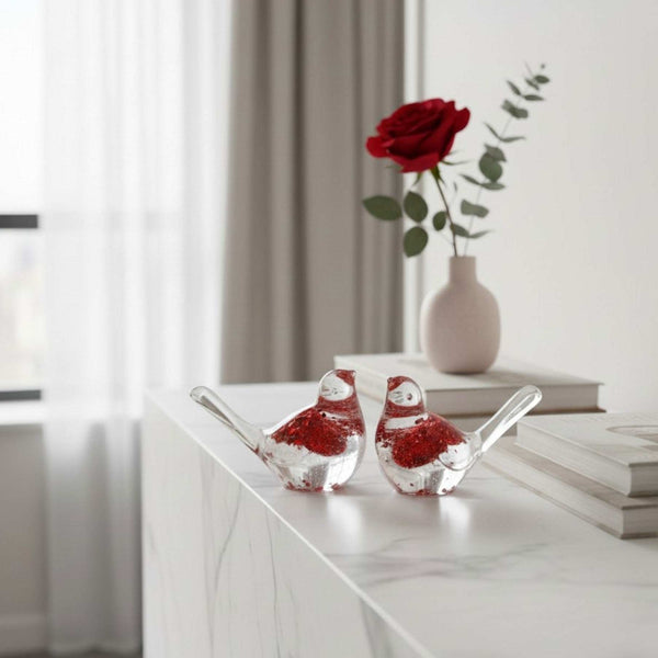 Scarlet Lovebirds red glitter resin bird pair perched together on a shelf with driftwood