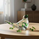 Clear resin bird figurine filled with real green four leaf clovers, vibrant green botanicals, and gold flakes,