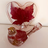 Maple leaf bird and tray set in clear resin, with red pressed maple leaves, gold flecks and a heart-shaped tray.