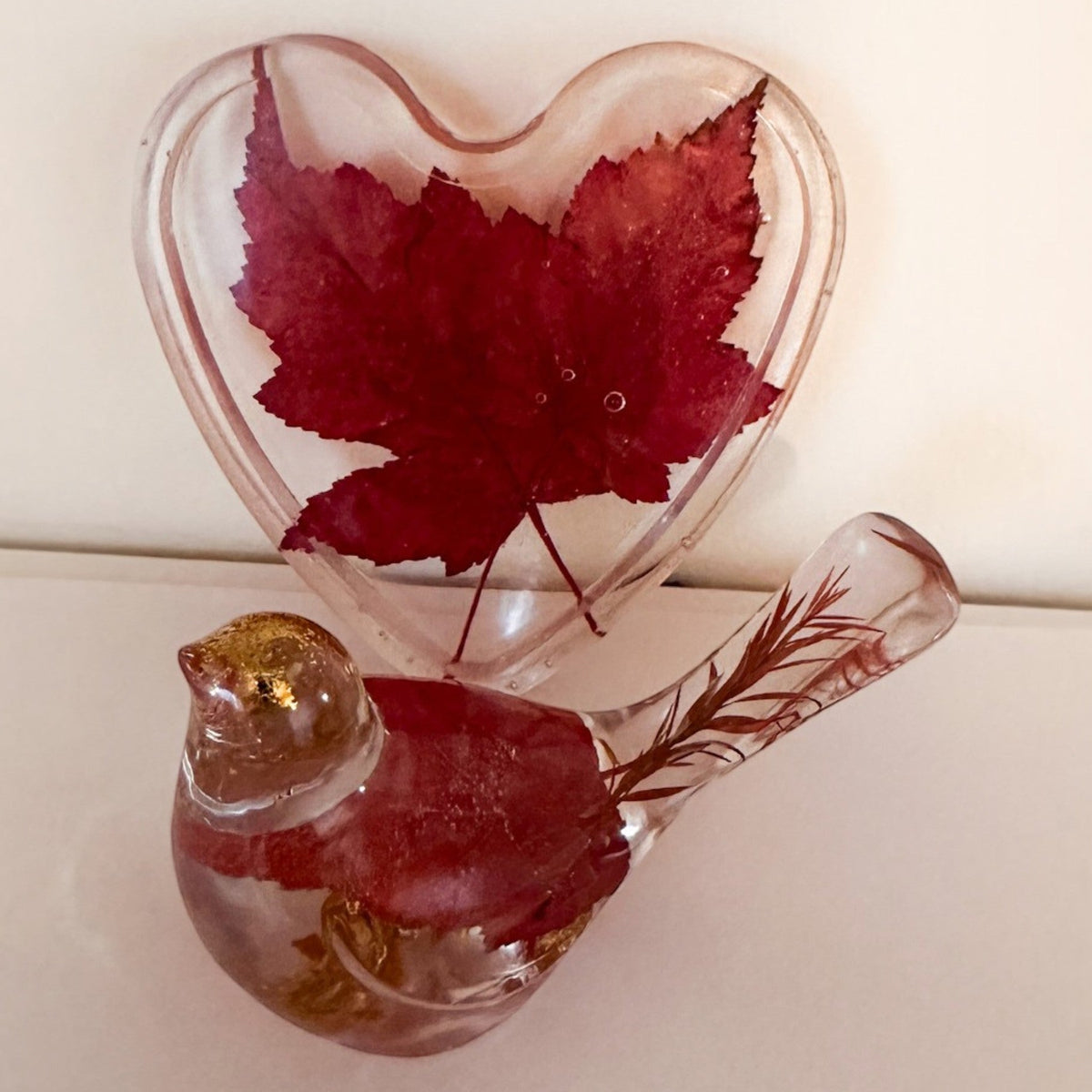 Maple leaf bird and tray set in clear resin, with vivid red leaves, gold accents, and a heart-shaped tray.