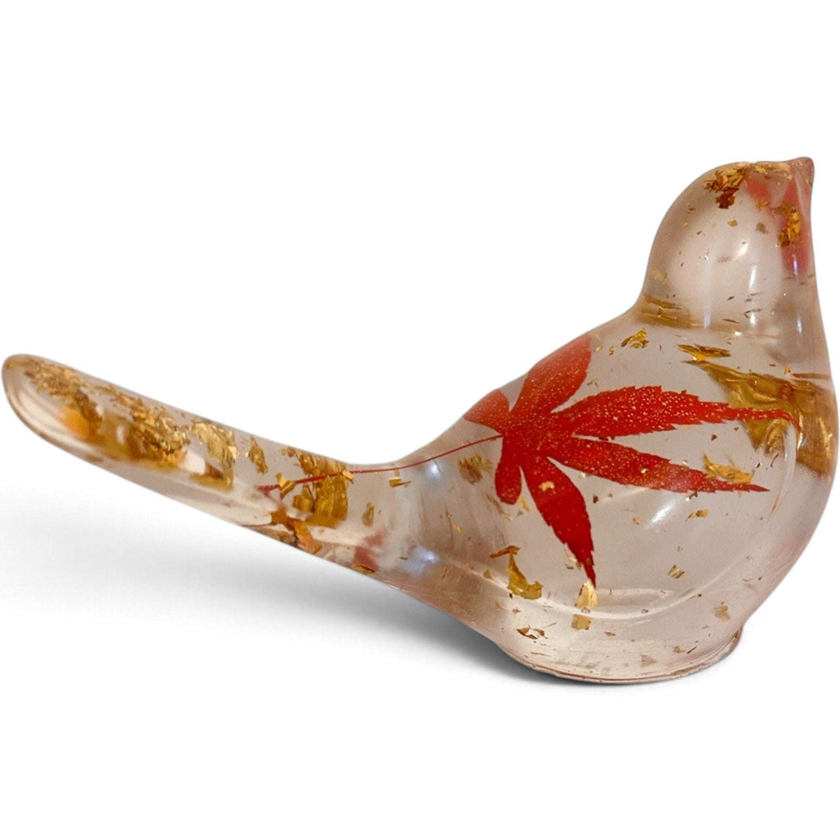 Maple Leaf Songbird made from clear resin, featuring a red maple leaf and scattered gold accents in a bird shape.