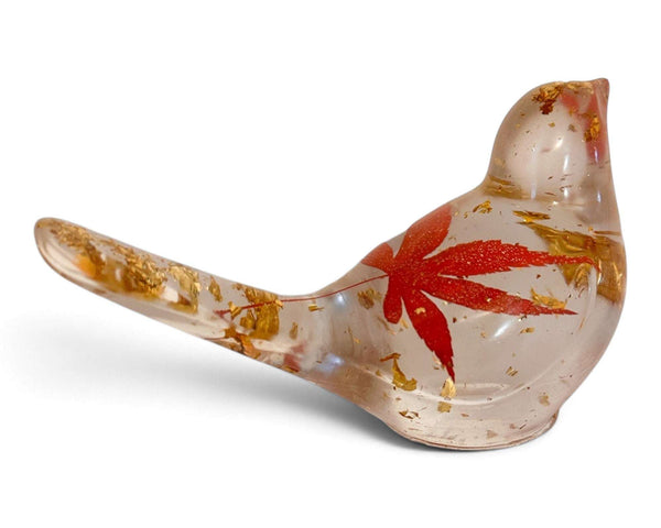 Maple Leaf Songbird made from clear resin, featuring a red maple leaf and scattered gold accents in a bird shape.
