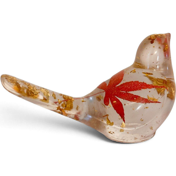 Maple Leaf Songbird made from clear resin, featuring a red maple leaf and scattered gold accents in a bird shape.