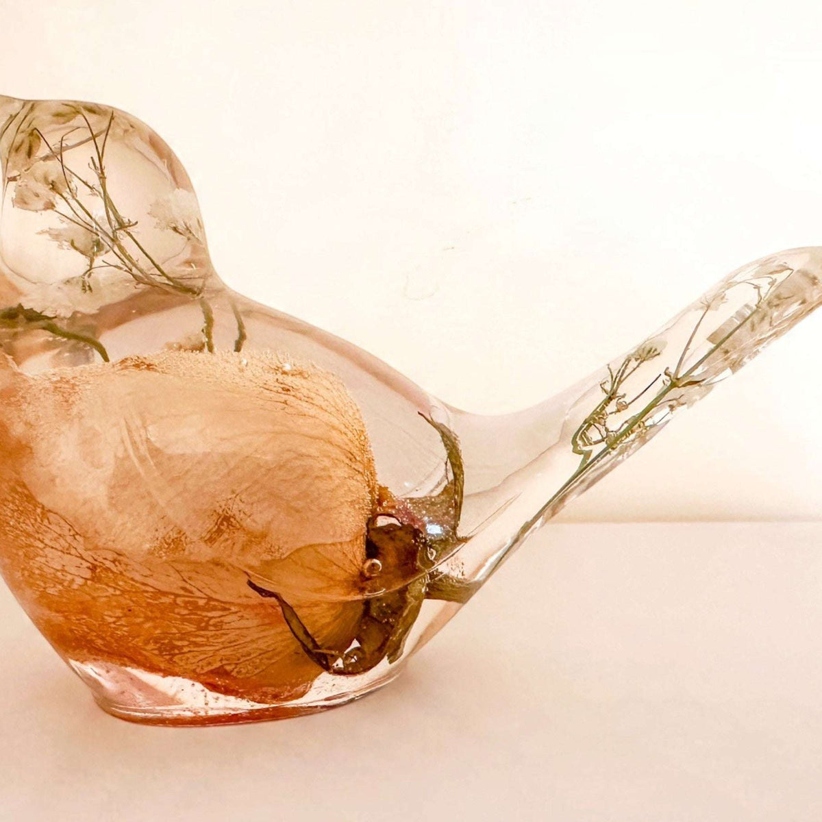 Memorial resin bird, a handmade keepsake holding real dried flowers in clear resin