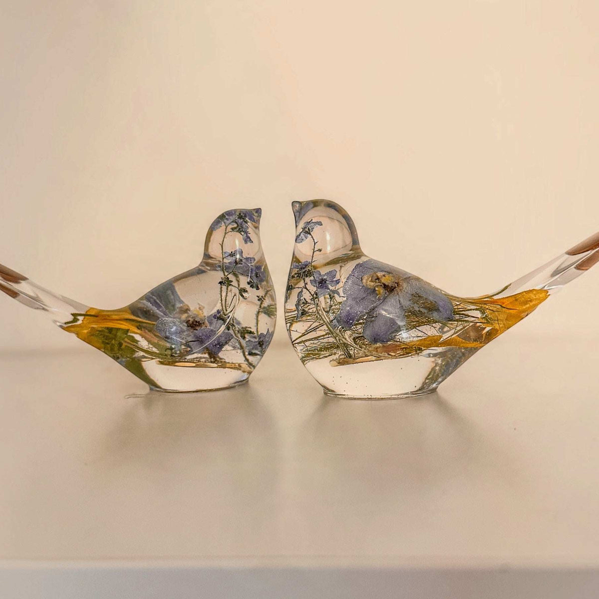 Memorial resin bird, a handmade keepsake holding real dried flowers in clear resin
