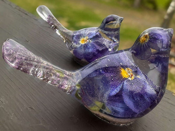 Memorial resin bird with ashes, pair of clear resin songbirds with purple forget-me-nots and shimmering bases