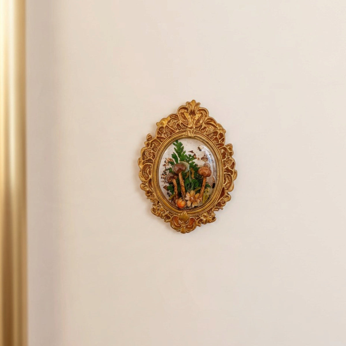 Mushroom fridge magnet on a fridge door, real forest mushrooms and ferns visible through the clear resin