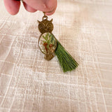 Antique bronze owl keychain with a tiny forest of mushrooms, ferns and moss set in resin