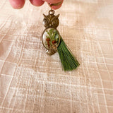Antique bronze mushroom owl keychain with its tassel and accent charm on the keyring
