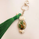 Silver owl keychain with real foraged mushrooms and green ferns set in clear resin