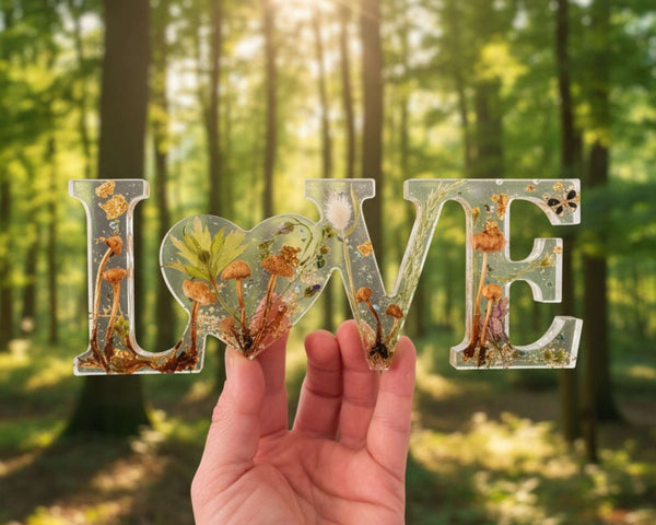 Resin mushroom decor LOVE word art with clear resin, real mushrooms, greenery, gold leaf and heart-shaped O