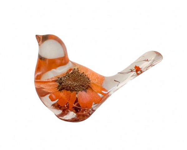 Orange sunflower resin bird decor with real orange sunflower embedded in clear resin and small floral accents in the tail.