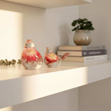 Close-up of real fluorite gemstones and pink strawflower preserved in hand-poured resin bird