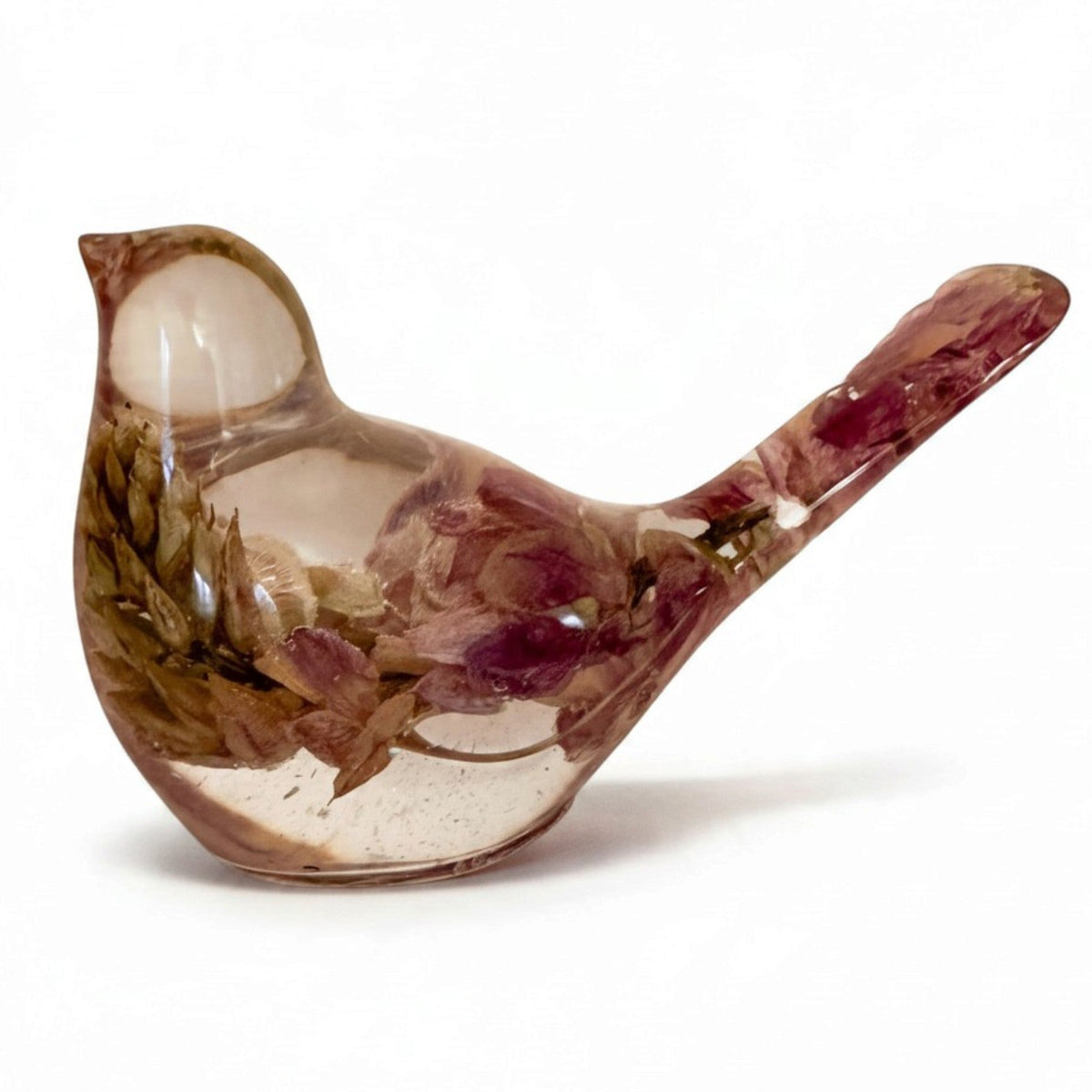Pink lupine resin bird figurine in glossy clear resin, with preserved pink and olive botanicals and a long raised tail.