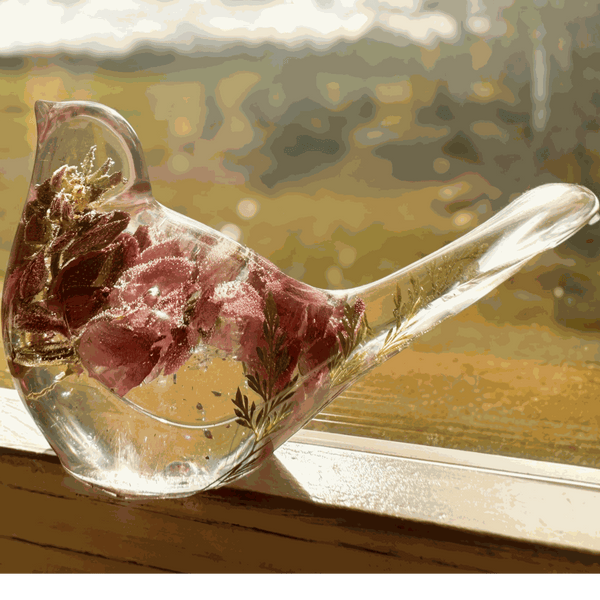 pink lupine resin bird decor with clear sculpted resin, pink dried blooms, green fern tail and glittered base