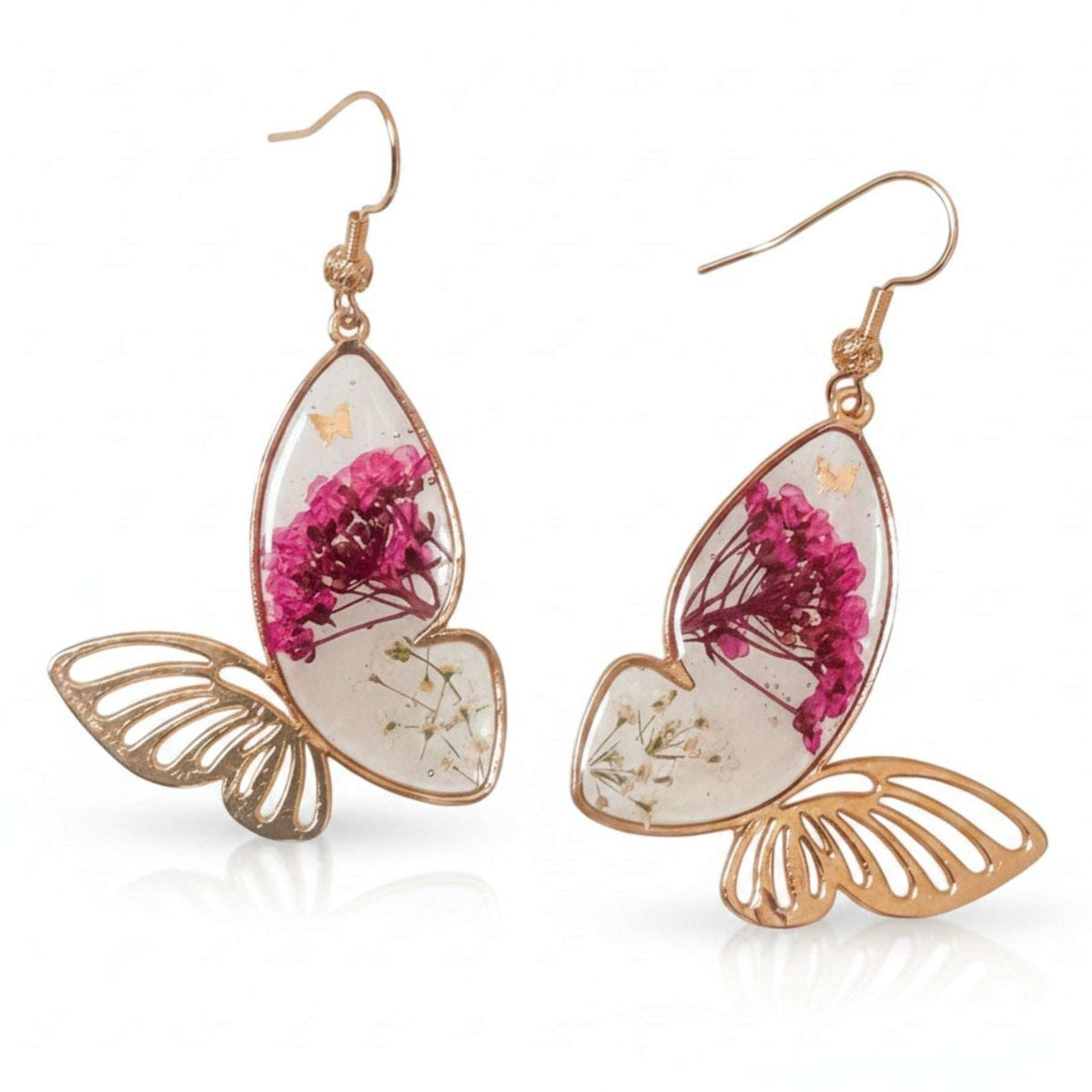 Rose gold Garden Wing Earrings with deep pink and white pressed flower butterfly wings encased in resin and gold butterfly accents