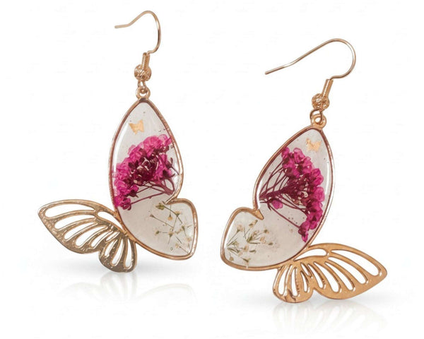 Rose gold Garden Wing Earrings with deep pink and white pressed flower butterfly wings encased in resin and gold butterfly accents