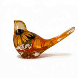 Golden Meadow resin bird featuring a preserved yellow flower with a dark centre and amber-gold accents in clear resin.