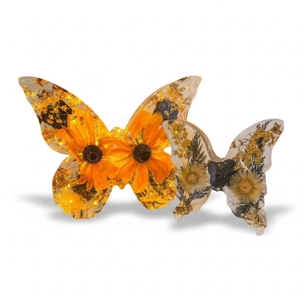 Light up resin butterfly decor set with two clear resin butterflies, orange blooms, dried flowers, and gold leaf‑style accents.