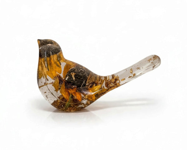 Black eyed susan resin bird with clear resin body, golden petals, dark brown flower centres and gold leaf flecks in its tail.