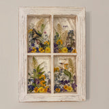 Pressed flower window art showing the dragonfly resting among the blooms in the lower pane