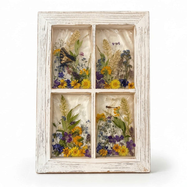 Pressed flower window art with a swallowtail butterfly and wildflowers in four resin panes