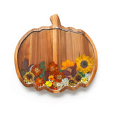 Handmade wooden pumpkin tray with real pressed sunflower, dried botanicals, bee charm, and gold glitter for fall decor