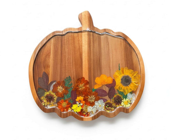 Handmade wooden pumpkin tray with real pressed sunflower, dried botanicals, bee charm, and gold glitter for fall decor
