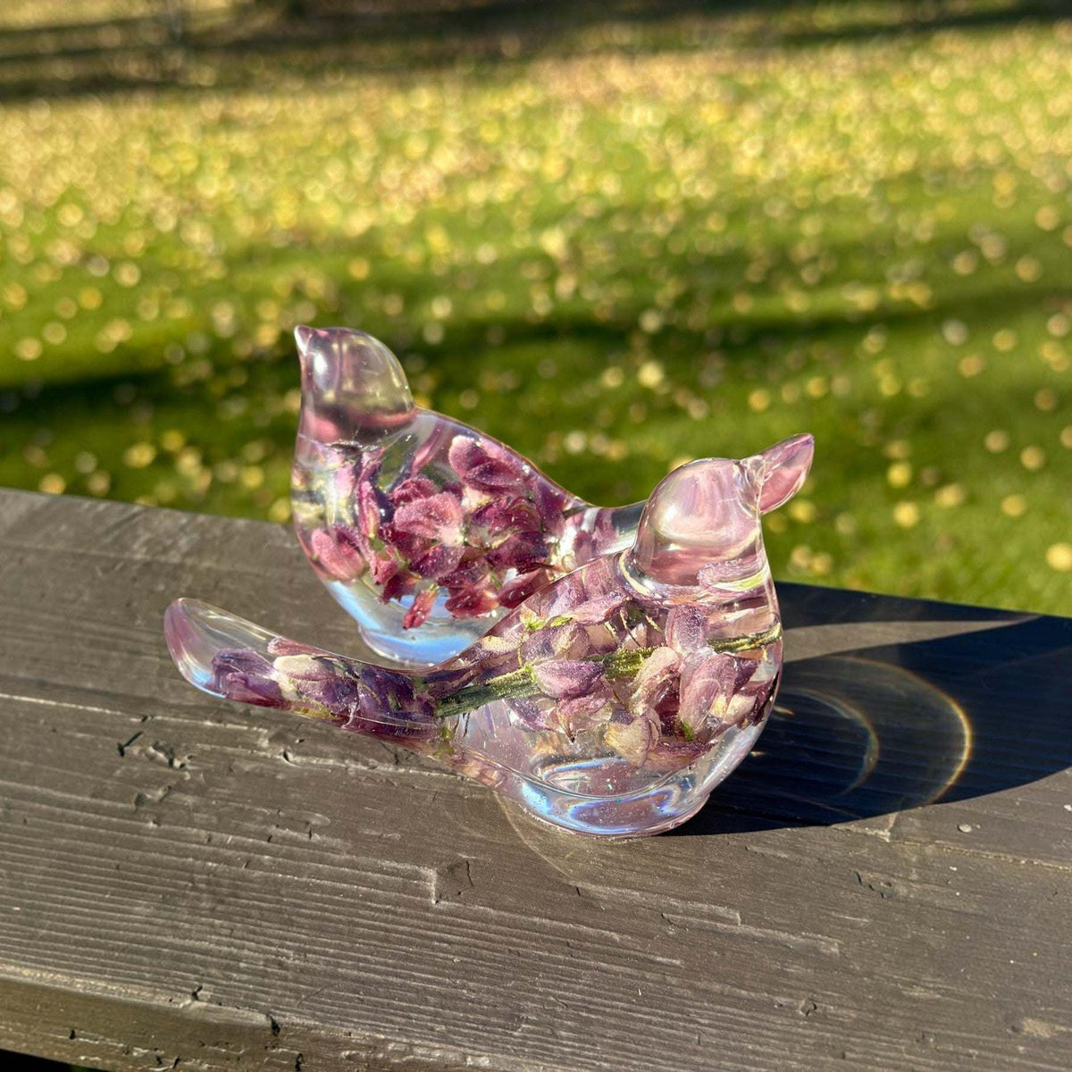 Purple lupine resin bird showing the shimmer worked through the clear base