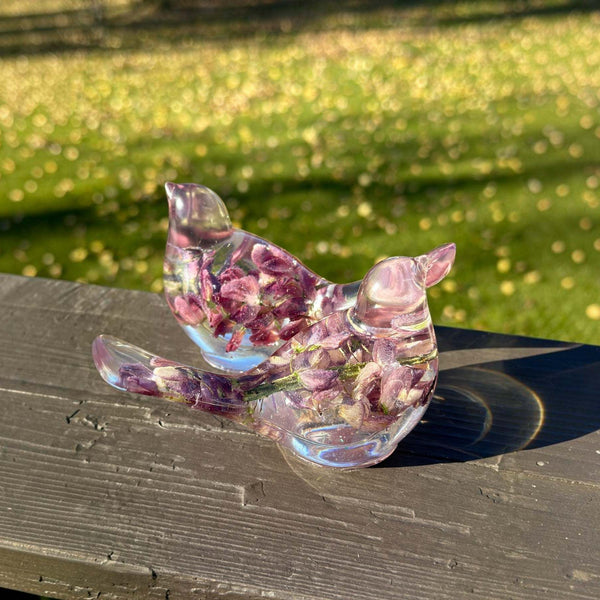 Purple lupine resin bird showing the shimmer worked through the clear base