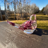 Side view of a purple lupine resin bird figurine with deep mauve petals