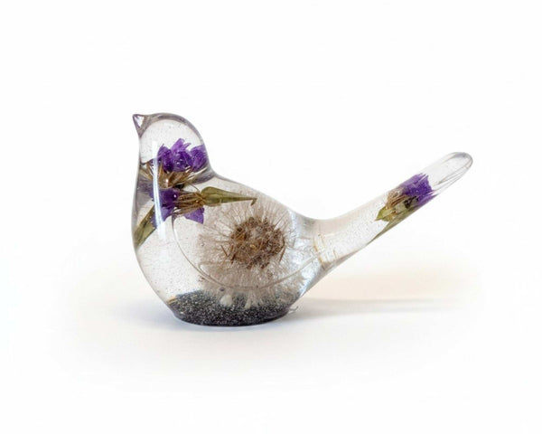 Handcrafted purple dandelion resin bird with real purple petals and dandelion seeds
