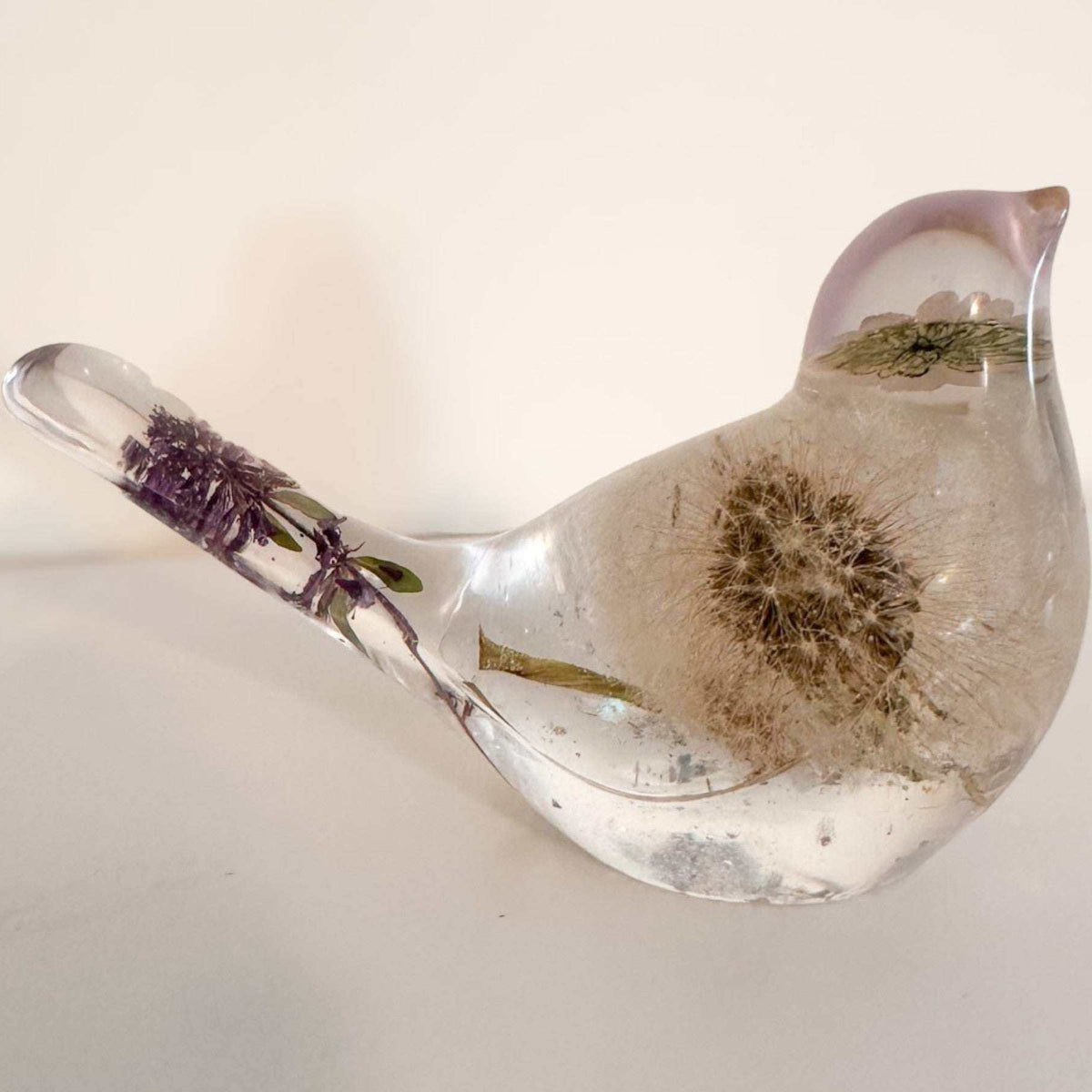 Purple dandelion resin bird with real purple flowers and dandelion seeds