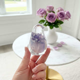 Handcrafted purple rose resin bird decor with preserved lavender rose inside