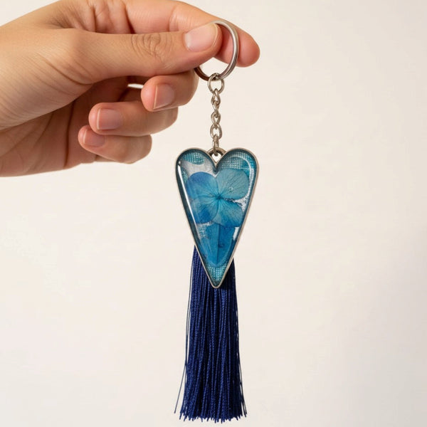 Sapphire Heart keychain with blue dried flowers in a silver-edged resin heart and a long navy tassel