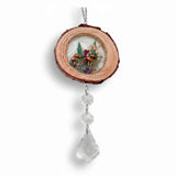Suncatcher with a natural wood slice frame, miniature mushroom and fern scene, and clear faceted crystal drops