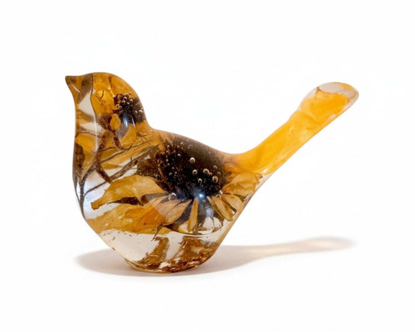 Sunflower resin bird decor in clear yellow resin with real dried sunflower petals and intricate botanical details inside.