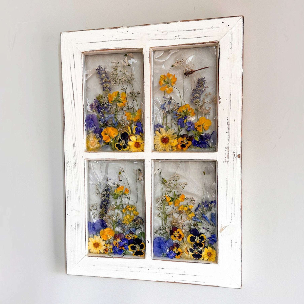Pressed Flower Window Frame with four clear resin panes of purple and yellow blooms, set in distressed white wood with a dragonfly.