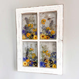 Pressed Flower Window Frame with four clear resin panes of purple and yellow blooms, set in distressed white wood with a dragonfly.