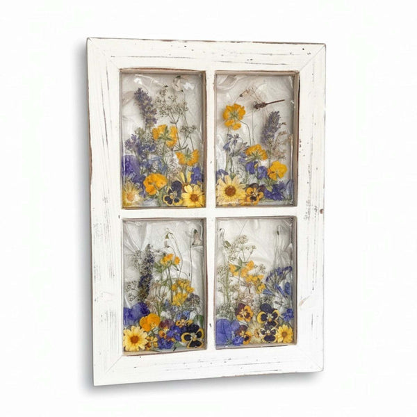 Pressed Flower Window Frame with a distressed white wood frame, four clear panes, and yellow and purple dried flowers.