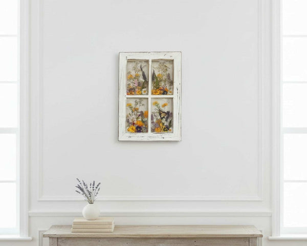 Pressed Flower Window Frame wall art with real dried wildflowers and insects in clear resin panes set in a distressed white wood frame.