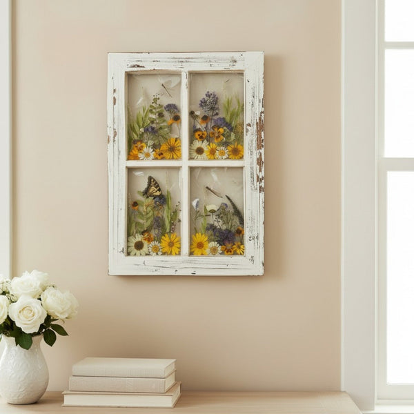 Pressed Flower Window Frame with a distressed white wood frame featuring four panes of real dried wildflowers and insects in clear resin