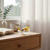 Handcrafted yellow floral resin bird with a real yellow daisy and gold leaf