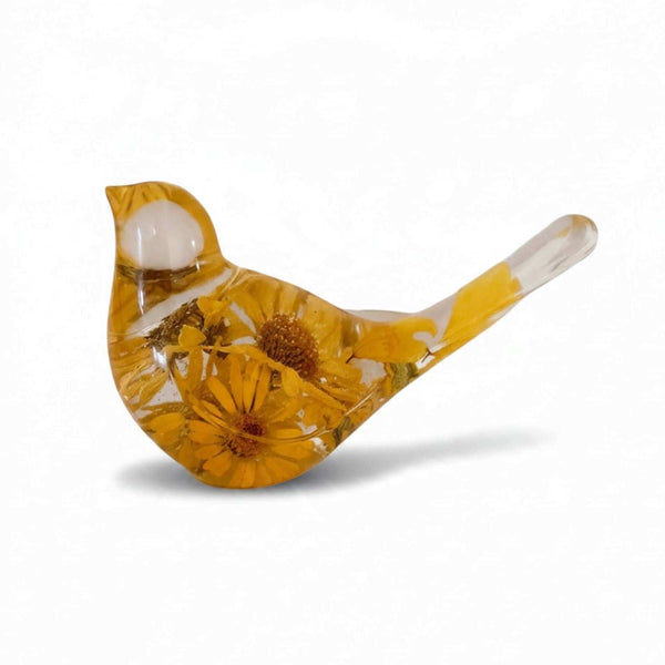 Yellow floral resin bird with pressed golden daisies and foliage in glossy amber resin, featuring a clear head and tail.